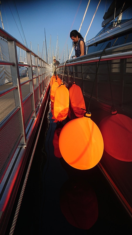 Orange Fendertex fenders on yacht
